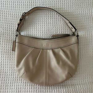 COACH handbag. Cream leather with tan lining. Silver hardware.